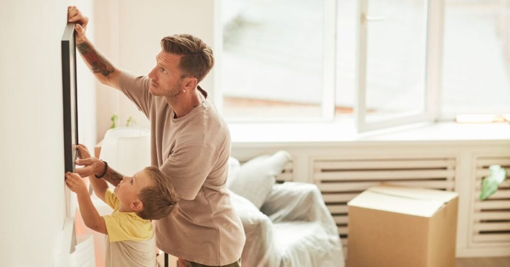 father and son using a Picture Hanging System