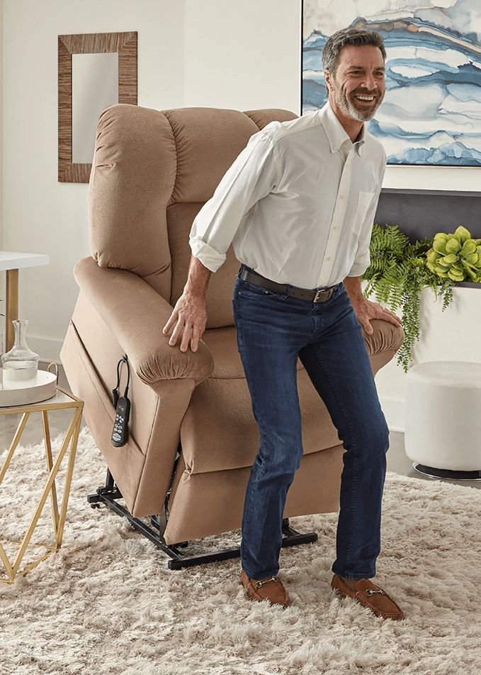 man with alzheimer's and diabetes getting up with the help of a power lift chair