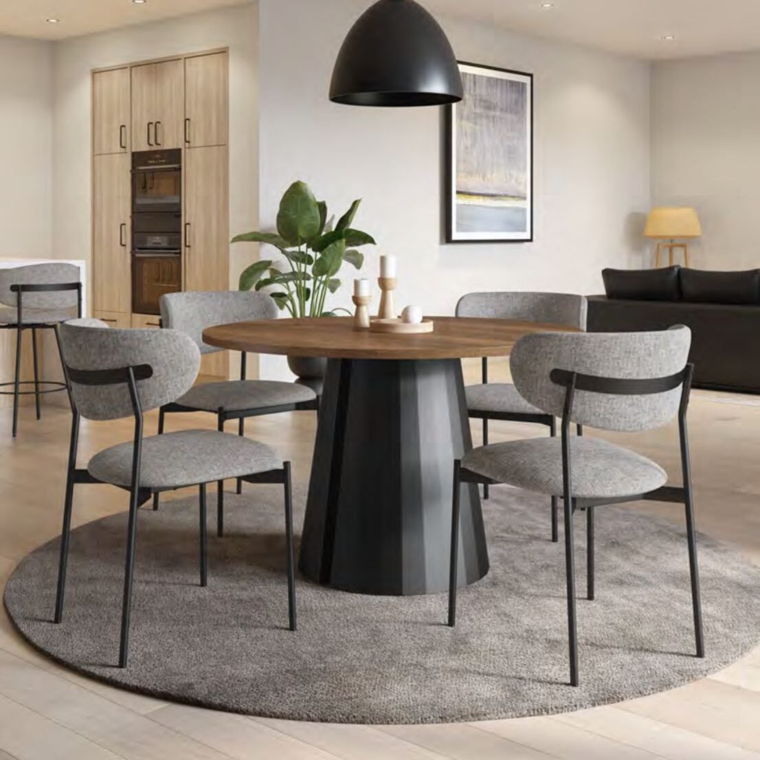 Elegant dining room table and chairs set up in White Rock furniture showroom